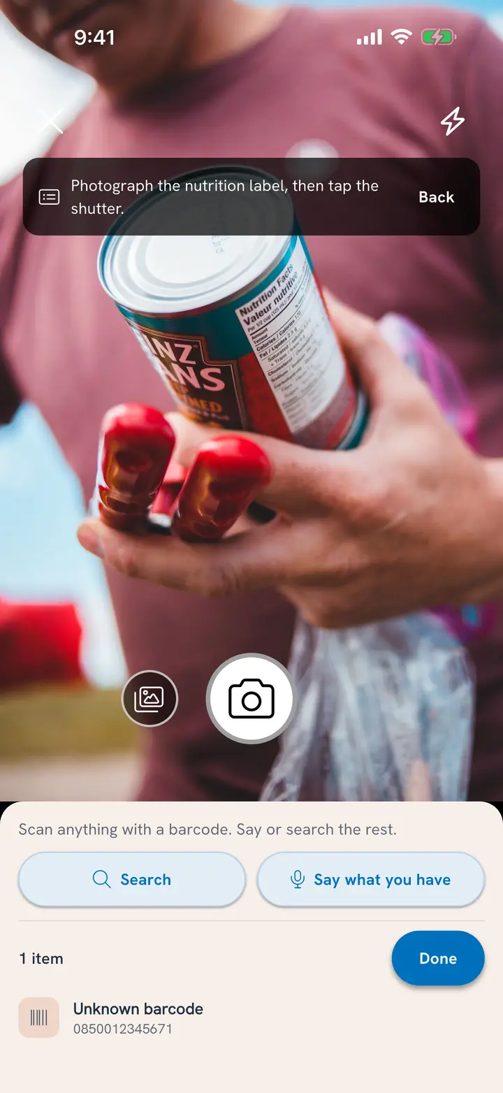 Scan nutrition label: a can held up with its Nutrition Facts panel toward the camera, and the banner Photograph the nutrition label, then tap the shutter
